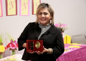 Juana Garcia showing her award