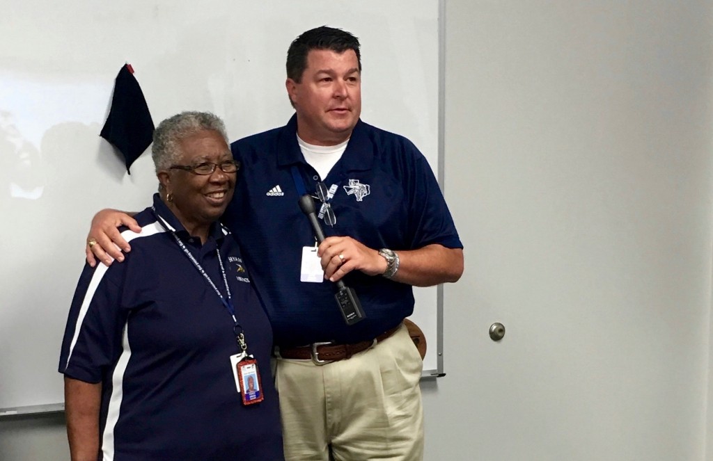 SMILING FACES - Bryan High Principal Lane Buban speaks glowingly about Coach Gregg at her 50 years of service presentation.